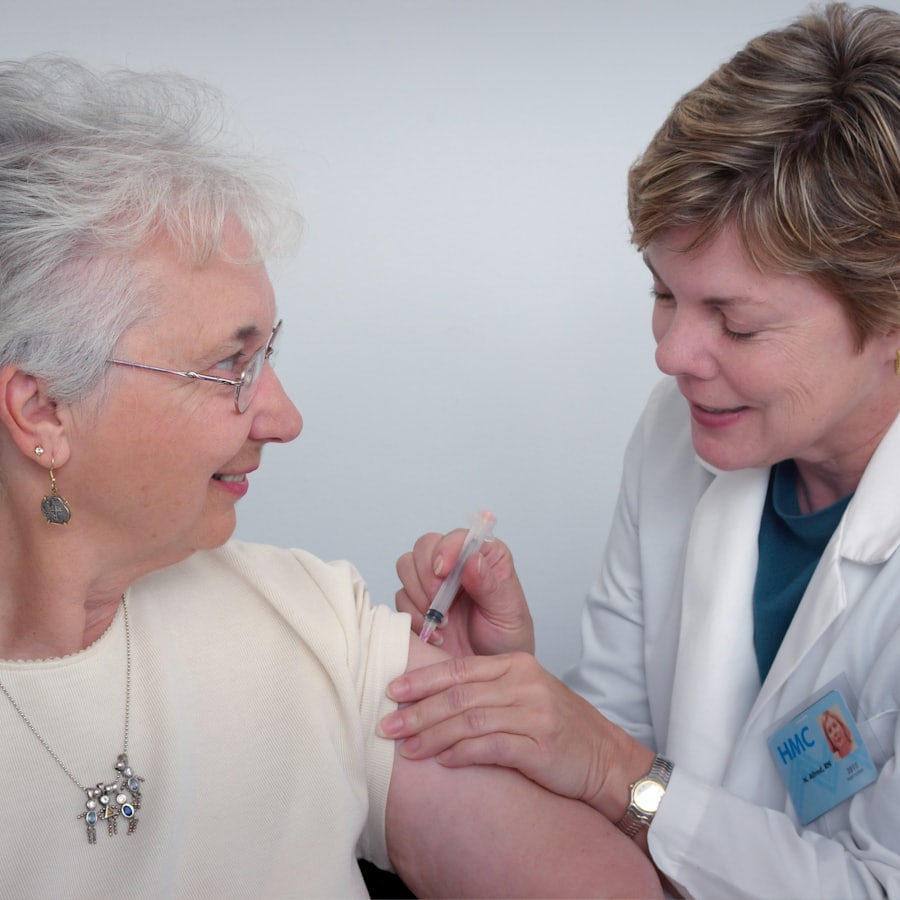 Community nurse providing care to an elderly patient